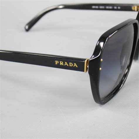 Prada sunglasses black and gold